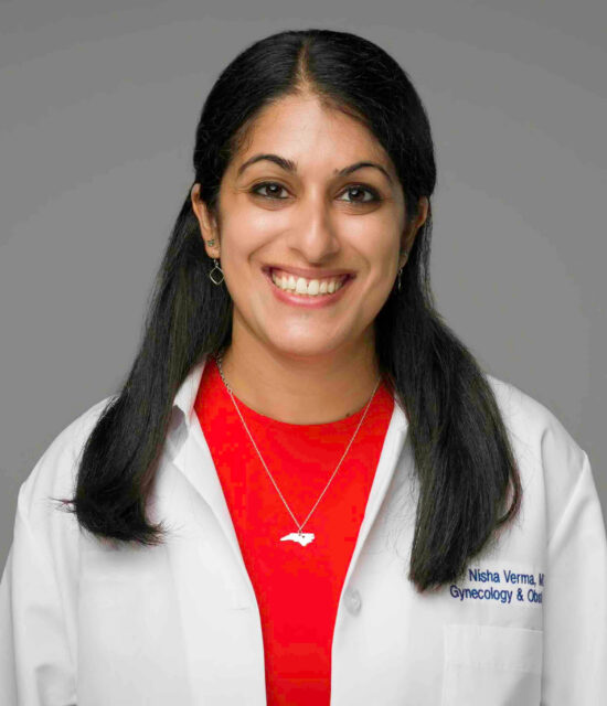 Dr. Nisha Verma, MD, MPH, FACOG, smiling at the camera